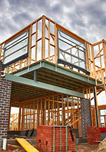 A building under construction with wood framing.