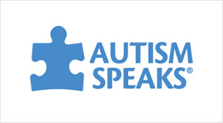 A blue puzzle piece with the words autism speaks written underneath it.